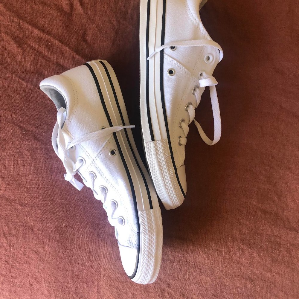 low top white Converse sneakers